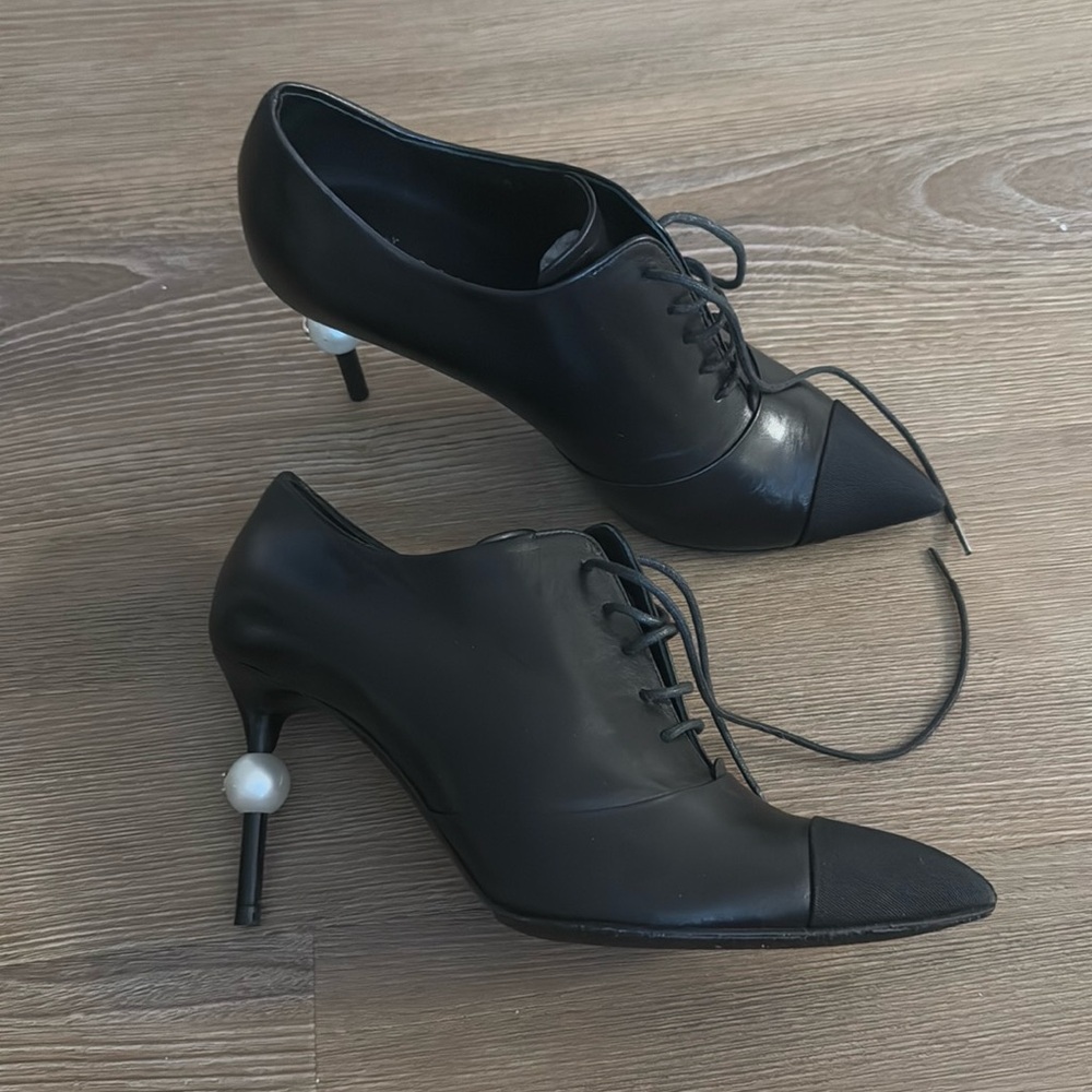 New Chanel heeled black leather boots